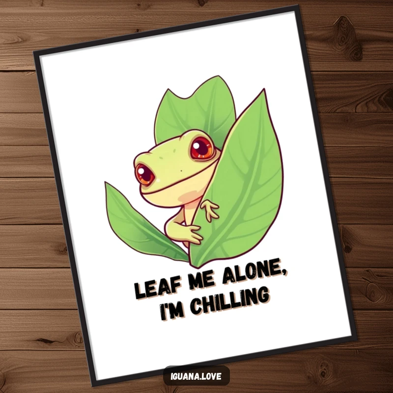 Funny Free Printable Wall Art, a stylized iguana with a cheerful expression peeks from behind a large, vibrant leaf.