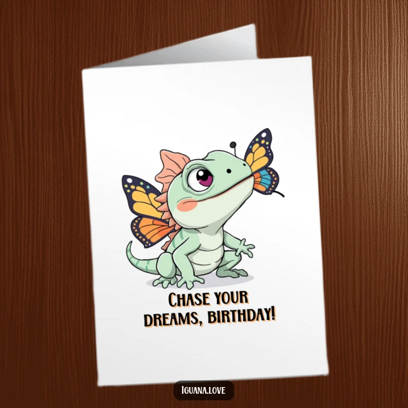 Funny Free Printable Birthday Card: An excited iguana with wide eyes pursuing a bright butterfly, celebrating joyfully.