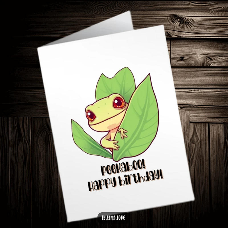 Funny Free Printable Birthday Card, a cheerful iguana peeks curiously from behind a large, vibrant green leaf.