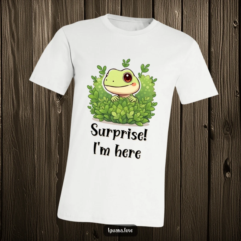 Funny t-shirt with a playful iguana character peeking curiously from behind a lush green bush, full of intrigue.